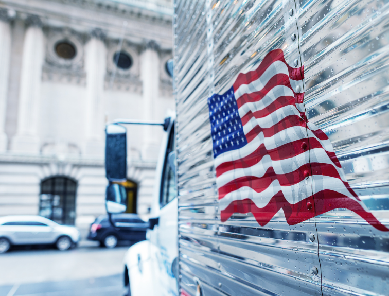 Image of American flag on the side of a semi truck.