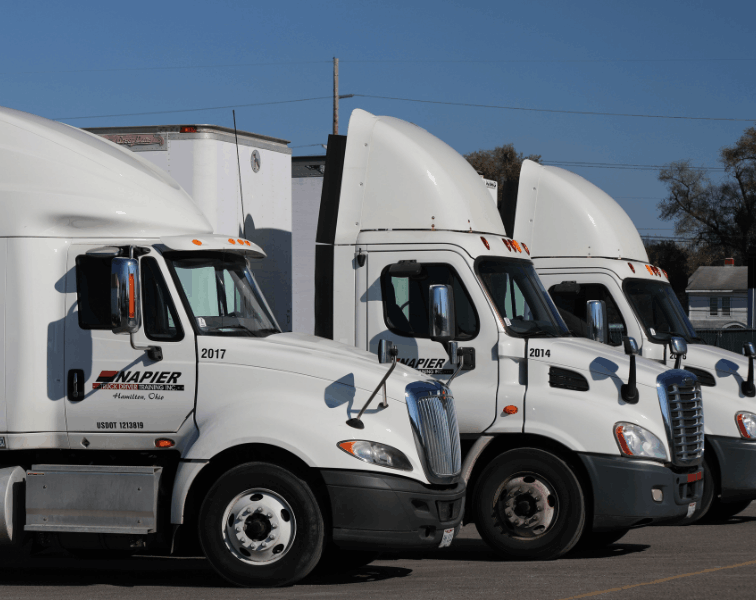 Three Napier semi truck cabs parked side-by-side